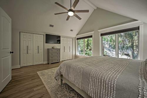 a bedroom with a bed and a ceiling fan at Luxury Family Home with Deck, Swim Spa and Grill! in New Buffalo