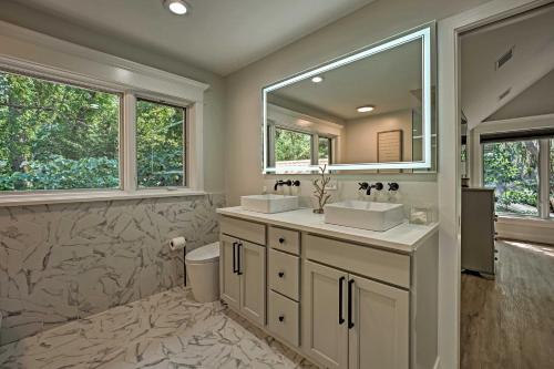 a bathroom with two sinks and a mirror at Luxury Family Home with Deck, Swim Spa and Grill! in New Buffalo
