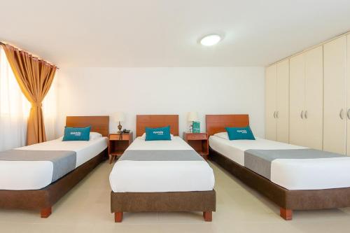 Кровать или кровати в номере Ayenda Ambeima