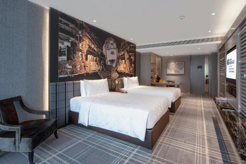 Postel nebo postele na pokoji v ubytování Hotel Indigo Shanghai Jing'An by IHG