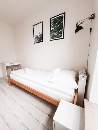 Ένα ή περισσότερα κρεβάτια σε δωμάτιο στο Apartament Kraków Arena