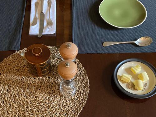 a wooden table with a plate of food on a table at Heathpark House in Blairgowrie