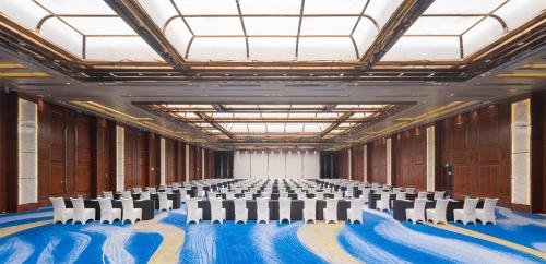 a large room with chairs and tables in it at Crowne Plaza Suzhou by IHG in Suzhou