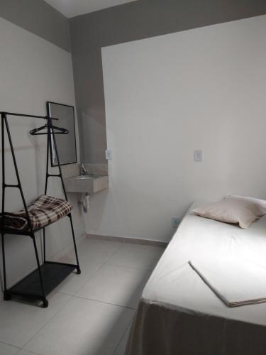 Ένα ή περισσότερα κρεβάτια σε δωμάτιο στο HSP - HOTEL SÃO PAULO