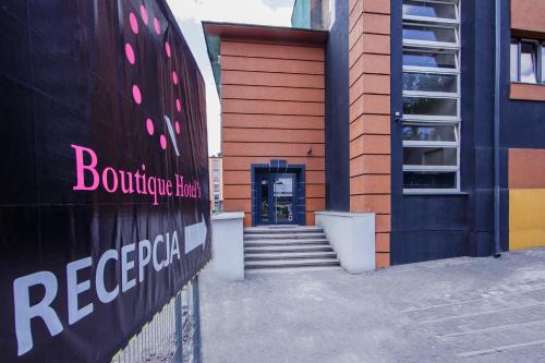 a building with a staircase leading to a door at Boutique Hotel's Bytom in Bytom
