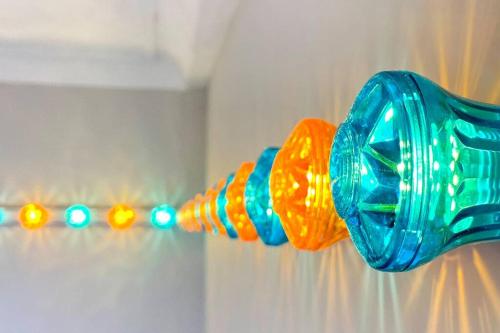 a blue and orange toothbrush hanging on a wall at Cleveland House - Perfect for Beaches and Town. in Bournemouth