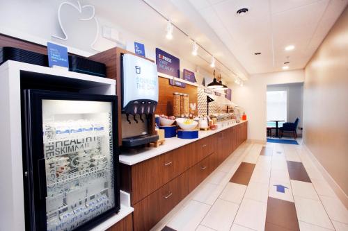 a store with a counter with avertisement for at Holiday Inn Express & Suites Bethlehem Arpt-Allentown Area in Bethlehem