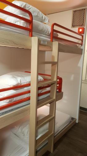 a group of bunk beds in a dorm room at hotelF1 Saint Etienne in Saint-Étienne
