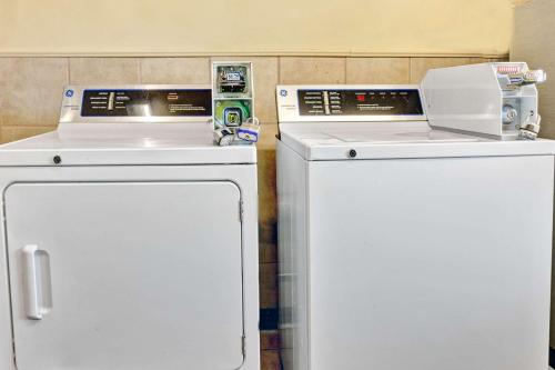 two machines sitting next to each other in a kitchen at Days Inn by Wyndham Louisville Airport Fair and Expo Center in Louisville