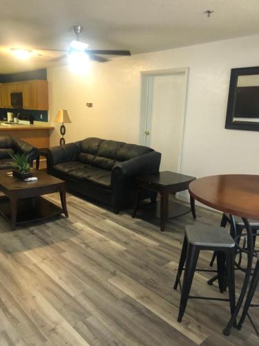 a living room with a couch and a table at THE BRANSINN Entertainment District in Branson
