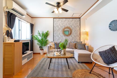 TV a/nebo společenská místnost v ubytování Type C Room 51平米 -ウル エスポワール石垣-