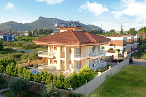 a rendering of a house with a roof at can apart hotel in Kemer
