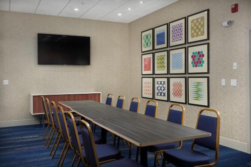 a conference room with a table and chairs at Holiday Inn Express - Lockport by IHG in Lockport