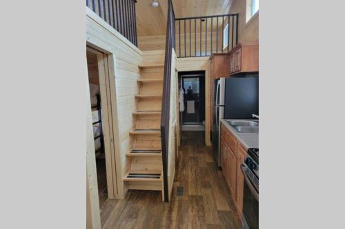 a tiny house with a staircase and a kitchen at 077 Tiny Home nr Grand Canyon South Rim Sleeps 8 in Valle
