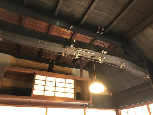 a chandelier hanging from the ceiling of a room at 古月(KozukI)久年庵 in Yamaguchi