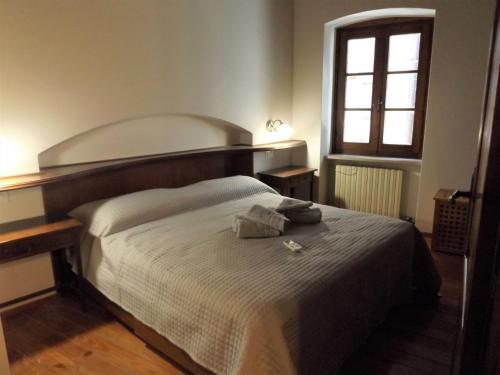 Postel nebo postele na pokoji v ubytování Casa Catullo
