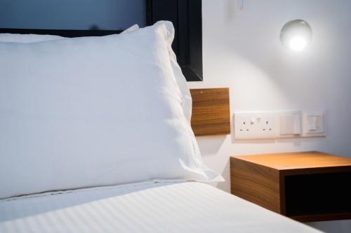 Letto o letti in una camera di Urban Habitat Executive Suites