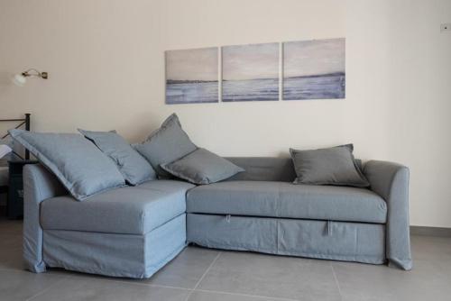 a couch in a living room with two pillows at Il Finto Pepe B&B in Formia