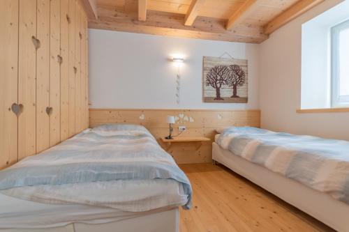 Ein Bett oder Betten in einem Zimmer der Unterkunft Chalet Francesca