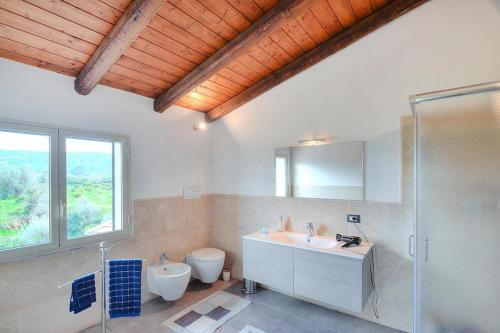 a bathroom with a sink and a toilet and a shower at Holiday Home Floridia - ISI02263-F in Floridia