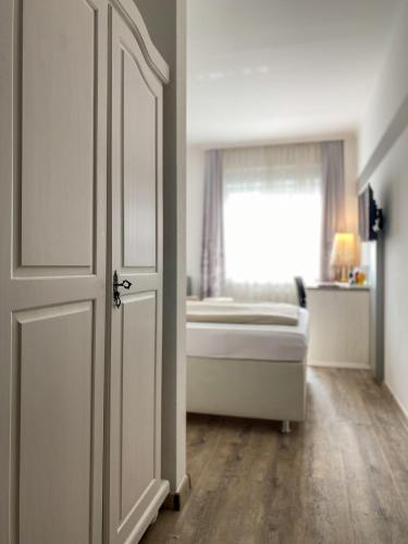 Postel nebo postele na pokoji v ubytování Hotel Angerland Garni