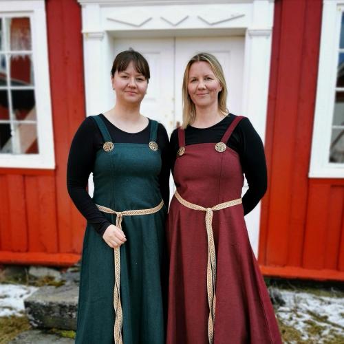 two women in dresses standing next to each other at Tranøya in Tranøya