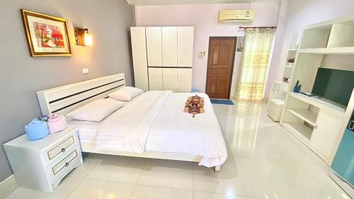 Katil atau katil-katil dalam bilik di Pennaung Resort