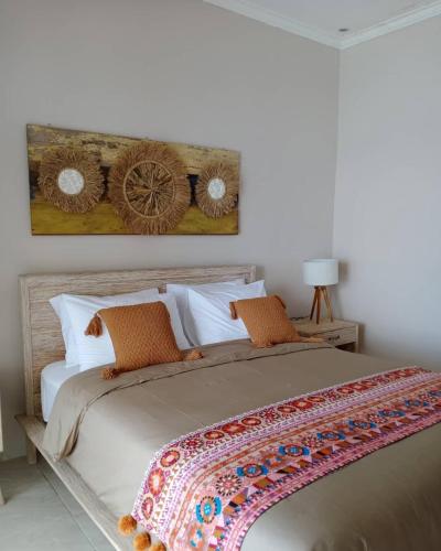 Ένα ή περισσότερα κρεβάτια σε δωμάτιο στο VnS Beachfront Guesthouse