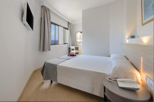 Postel nebo postele na pokoji v ubytování Hotel Vibra Beverly Playa