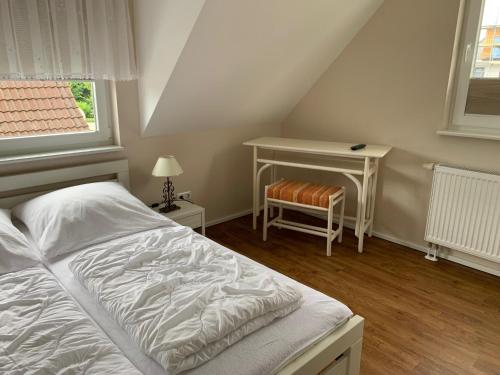 Postel nebo postele na pokoji v ubytování Ferienhaus Ankerplatz