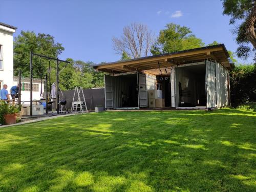 a garage with a grass yard at Hotel Clement - Bed & Breakfast in Ingelheim am Rhein