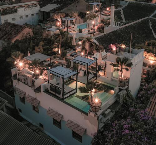 an aerial view of a building at night with lights at Hotel Casa Lola Deluxe Gallery in Cartagena de Indias
