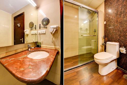 a bathroom with a sink and a toilet at Oriva Suvee Boutique Banashankari in Bengaluru