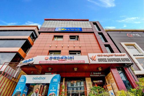 a building with a sign on the side of it at Oriva Suvee Boutique Banashankari in Bengaluru