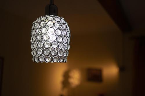aendant light hanging from a ceiling in a room at La Valle B&B in Asti