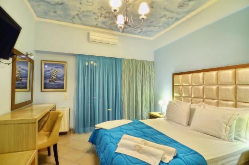 Säng eller sängar i ett rum på Hotel Parga Princess
