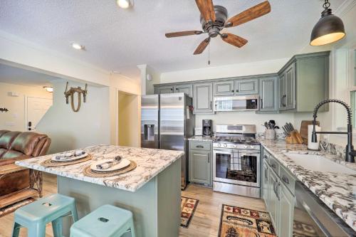 a kitchen with a counter top and a ceiling fan at 9 Mi to Sugar Mountain Newland Cabin with Fire Pit! in Newland
