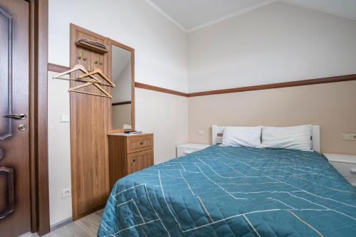 Ένα ή περισσότερα κρεβάτια σε δωμάτιο στο Inn Okolitsya