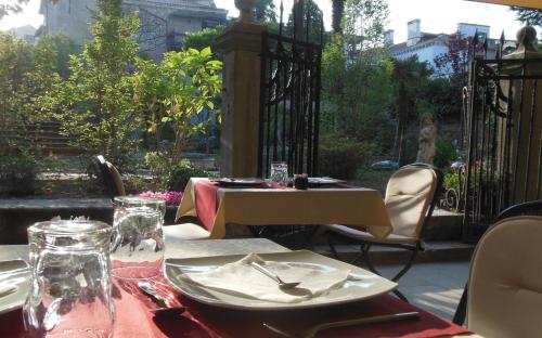 a table with a plate of food on a patio at Hotel Sant'Antonin in Venice