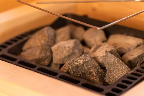 a basket of rocks sitting on top of a table at Weinberg Chalet Klöch in Klöch
