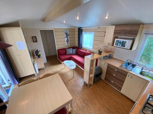 an aerial view of a living room with a red couch at Mon Coin de Vendée in Saint-Jean-de-Monts