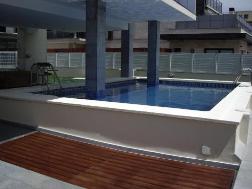 a swimming pool on the roof of a building at Port D'Aro in Platja d'Aro