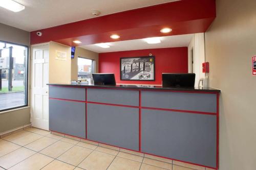 a waiting room with two laptops on a counter at Super 8 by Wyndham Sandusky in Sandusky