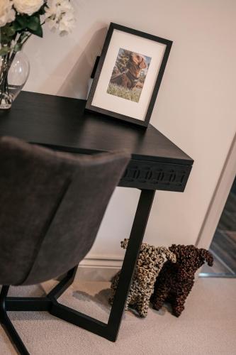 a black table with a picture on top of it at South Causey Inn in Stanley
