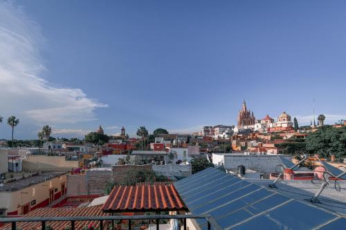 a view of a city from the roof of a building at Casa Maricela B&B in San Miguel de Allende