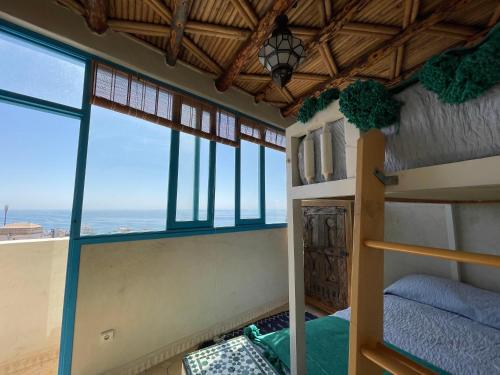 Postel nebo postele na pokoji v ubytování Taghazout Ocean View
