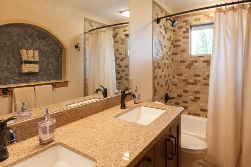 a bathroom with a sink and a toilet and a shower at Hood View 30 Day Minimum cabin in Mount Hood