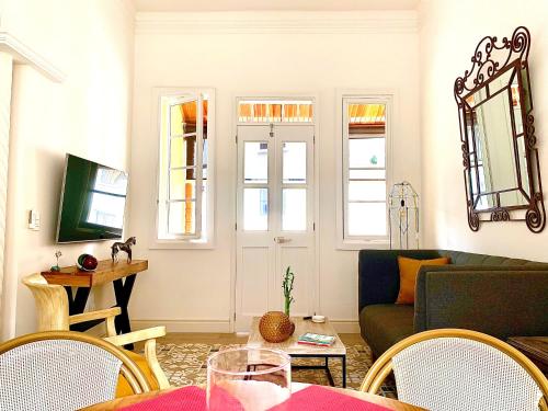 a living room with a couch and a table at Casa Rambla Serra Cali in Cali