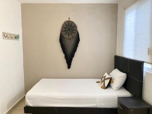 Una cama o camas en una habitación de Coco Suites by Andiani Travel