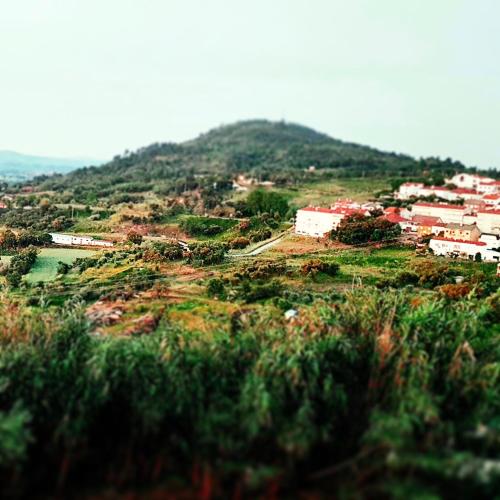 a view of a hill with houses and a train at Casa Dr. Saba in Belmonte